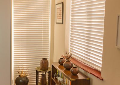 Full length and half-length white venetian blinds