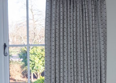 Grey geometric curtains with matching box pelmet