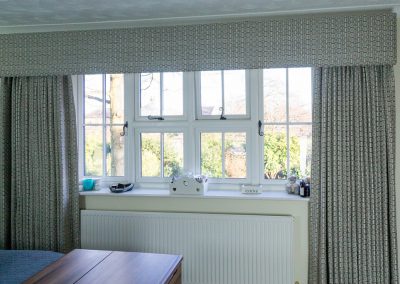 Full length grey geometric curtains with matching box pelmet