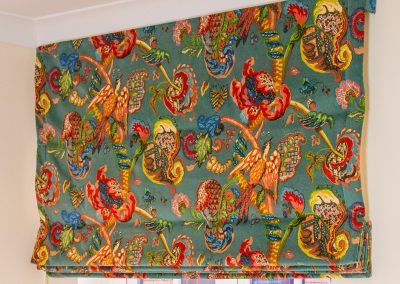 Close up of roman blind in highly decorative fabric